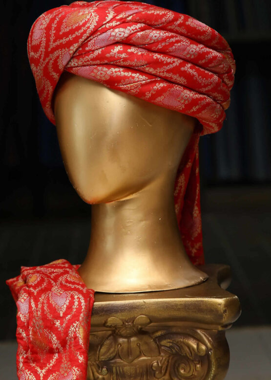 Man wearing a maroon Rajasthani turban