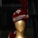 A close-up view of a Velvet Turban, showcasing its intricate patterns and rich texture